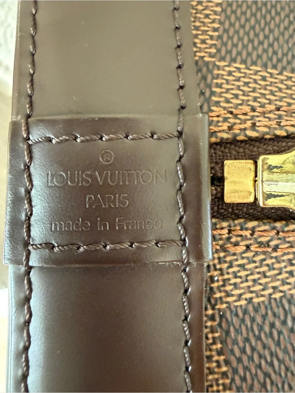 Louis Vuitton imperfections lock